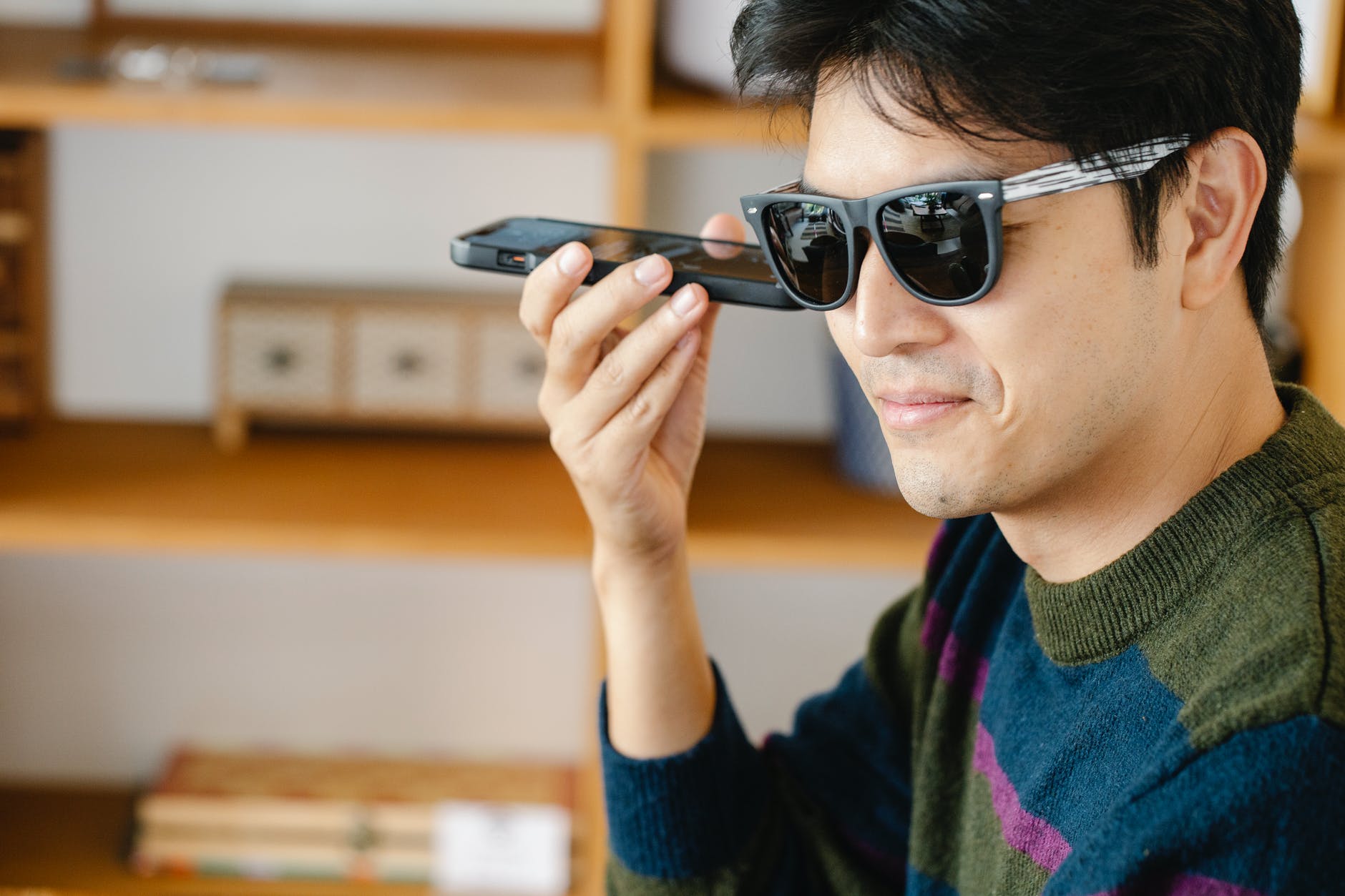 man listening closely on his mobile phone