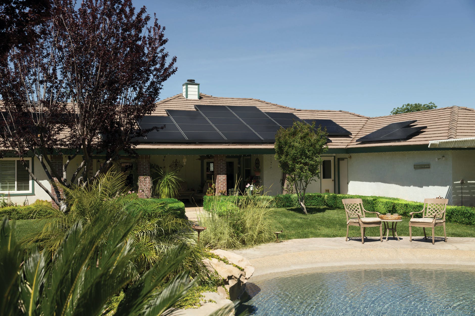 black solar panels on brown roof