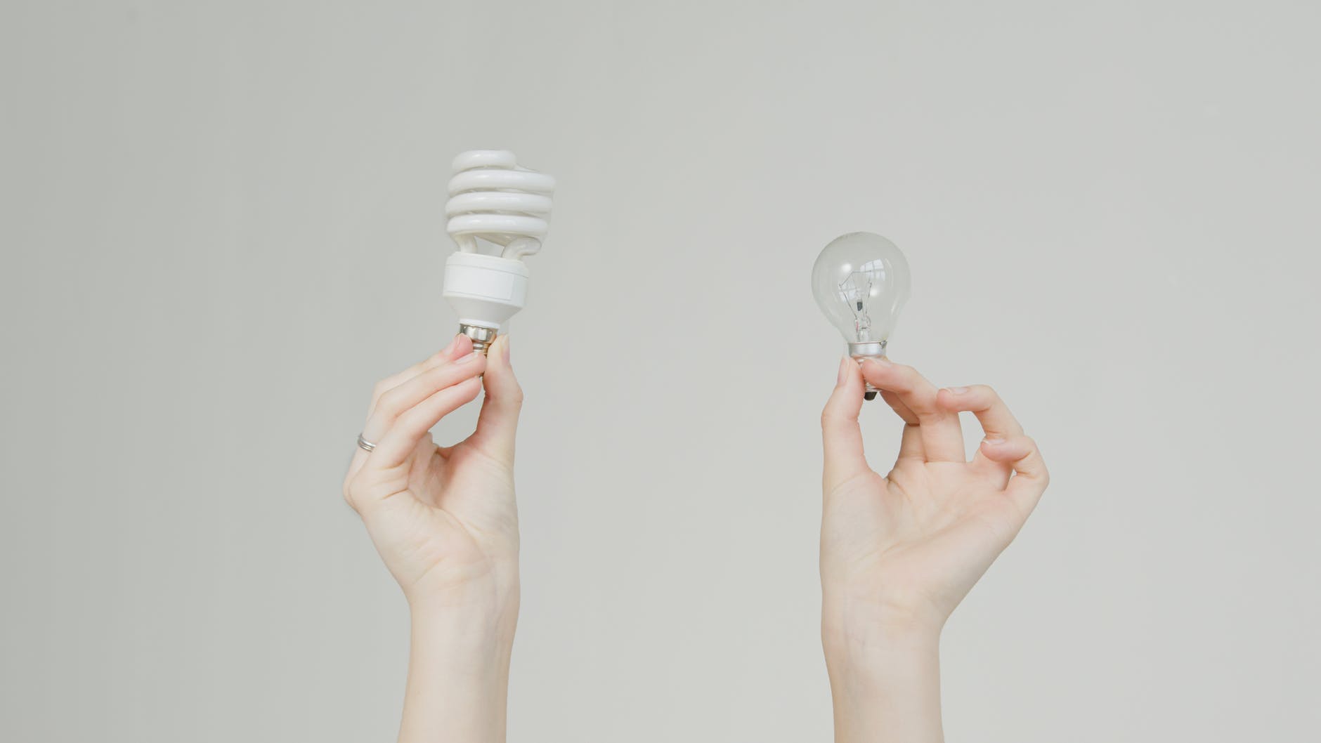 person holding white light bulb