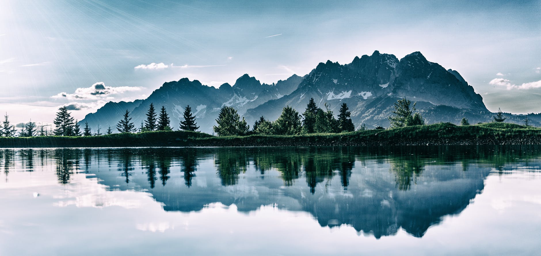 plain field in front of mountain peak