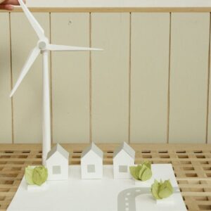 Revolutionizing Storage with Shwan Lamei of Emulate Energy a scale model of houses and wind turbine on cardboard
