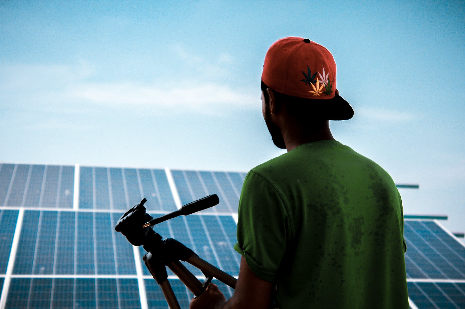 man facing solar panels