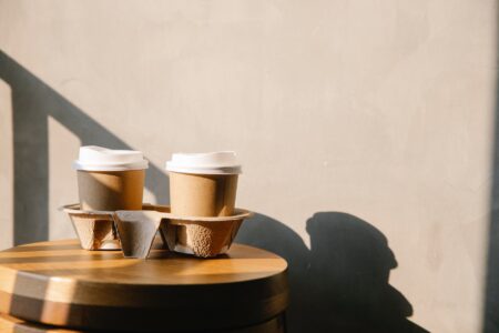 coffee paper cups on holder tray on table
