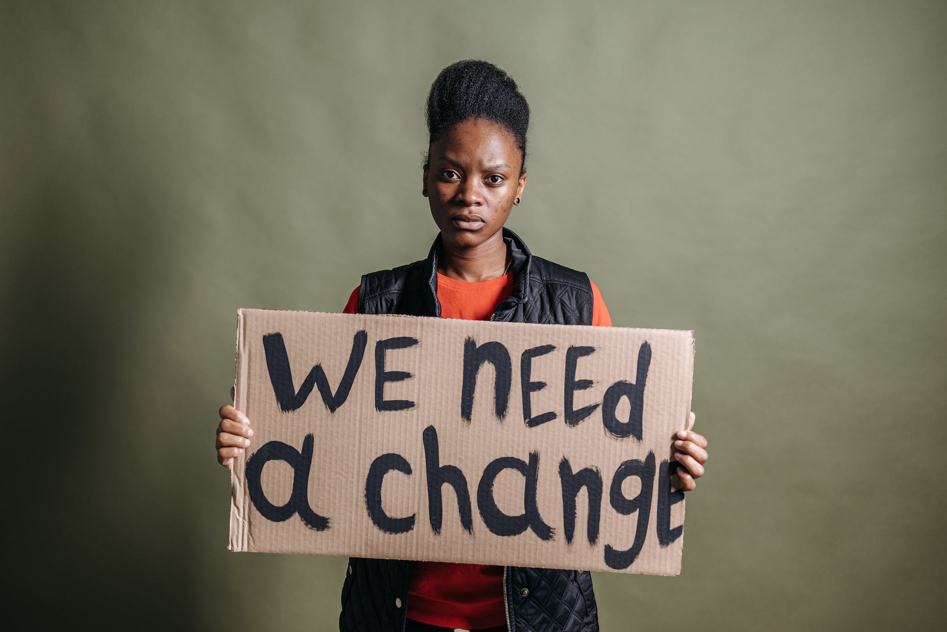 a woman holding a placard