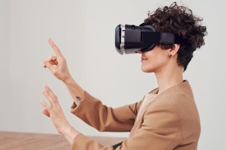 Helping Academic Communities In Envisioning The Future woman using virtual reality goggles
