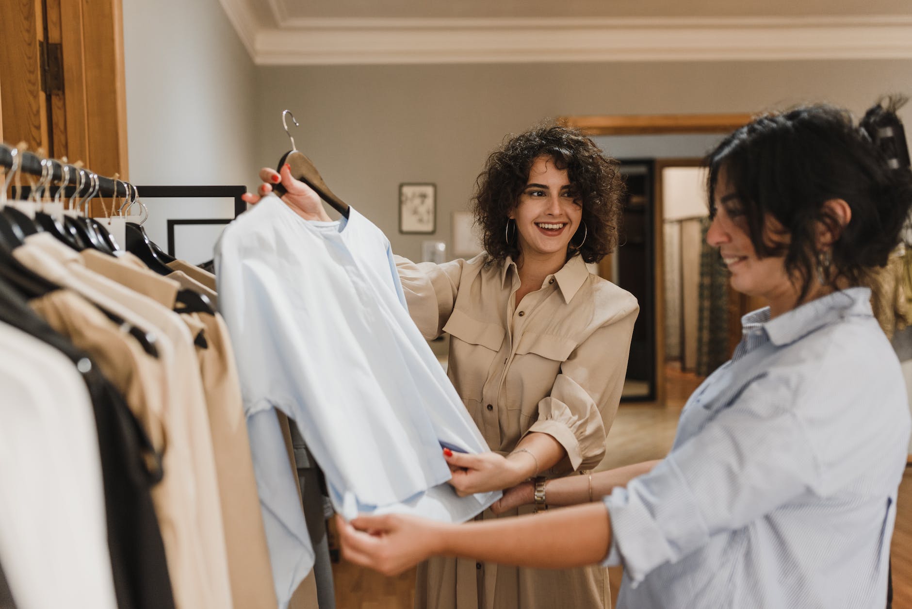 women buying clothes together